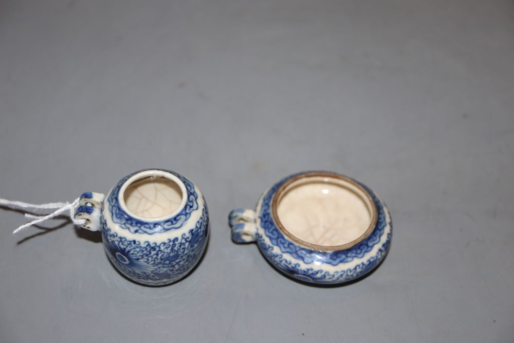 Two Chinese blue and white bird feeders, largest diameter 5cm